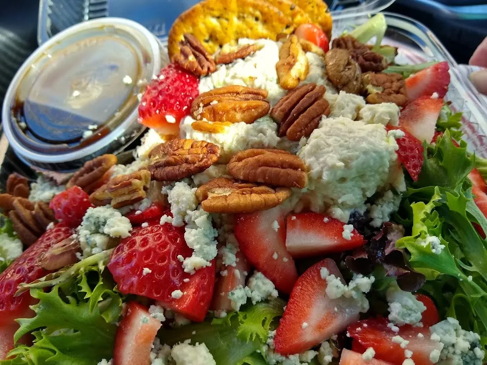 Chicken Salad on a Strawberry Pecan Salad with Berry Vinaigrette Dressing